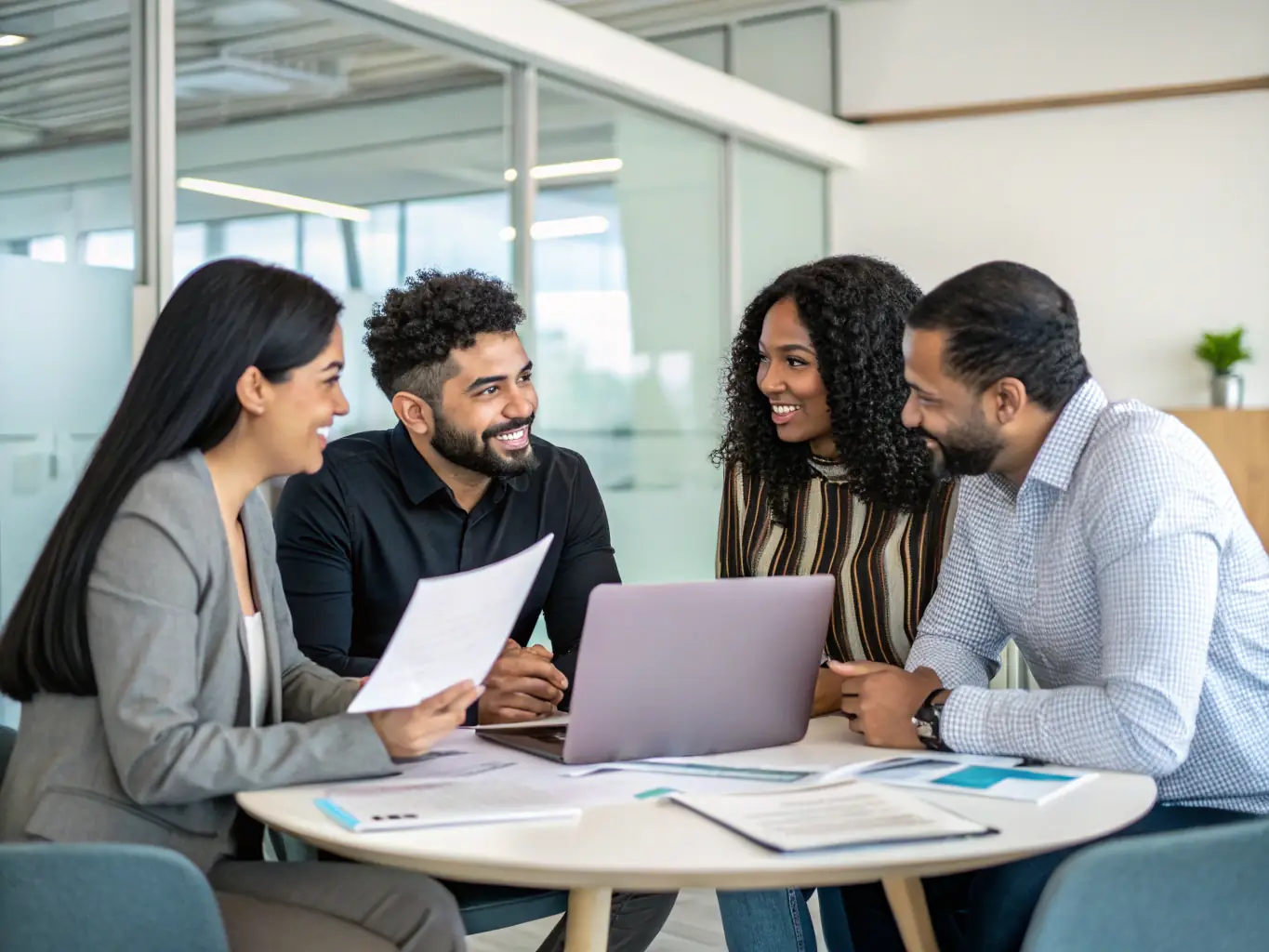 A diverse team of UK entrepreneurs brainstorming ideas in a brightly lit office, using whiteboards and collaborative tools to foster innovation and creativity.